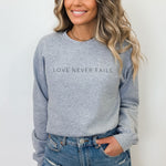 Load image into Gallery viewer, Love Never Fails Sweatshirt
